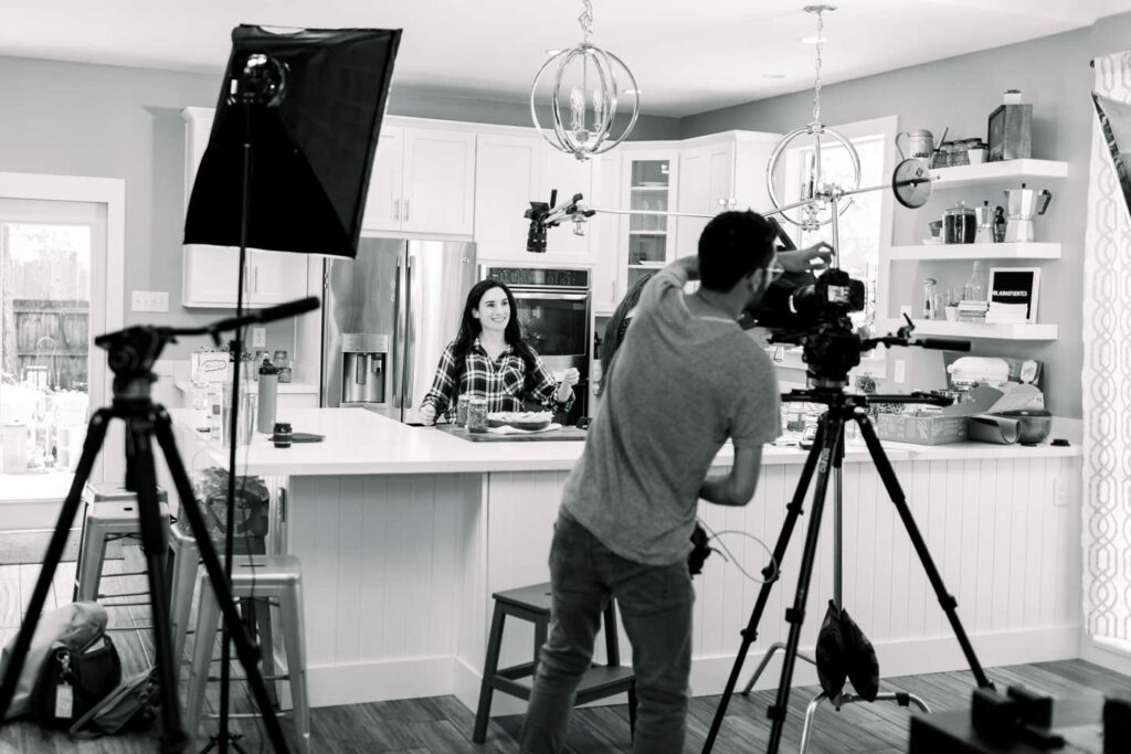 Laura Fuentes in studio kitchen filming